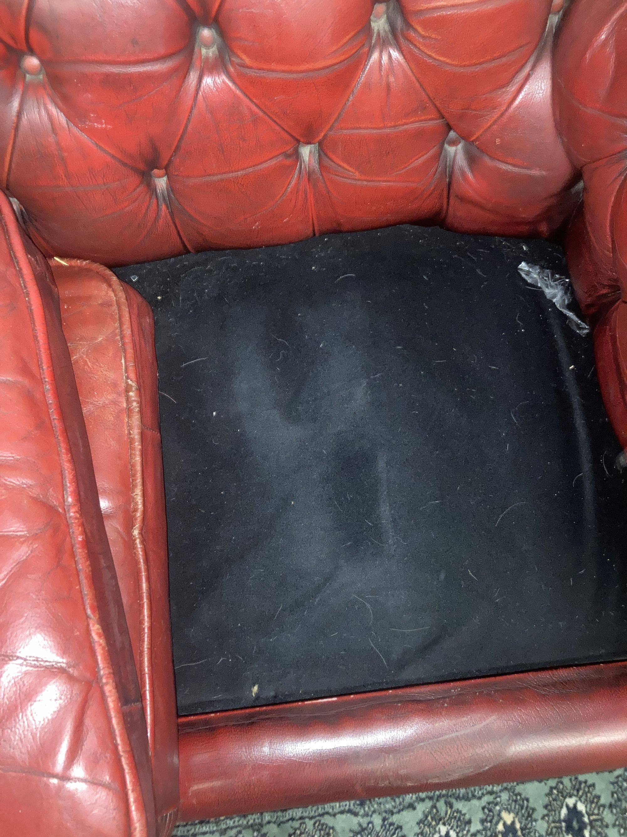 A Victorian style buttoned red leather Chesterfield settee, width 186cm depth 84cm height 66cm